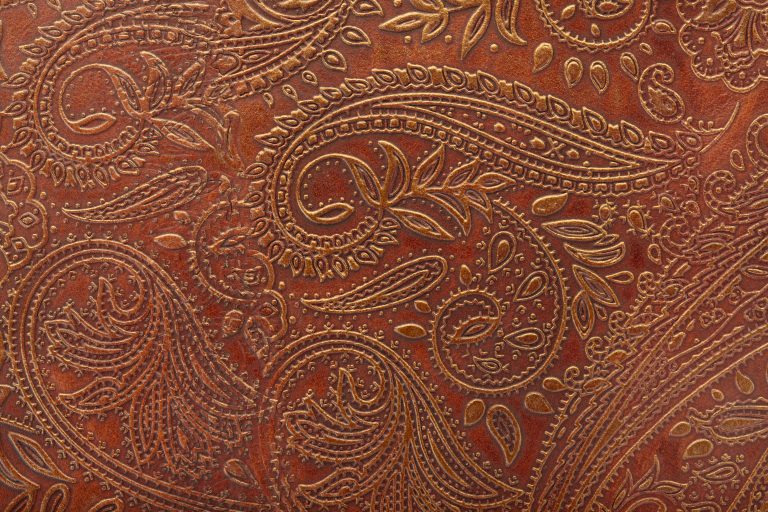 A brown tooled floral pattern