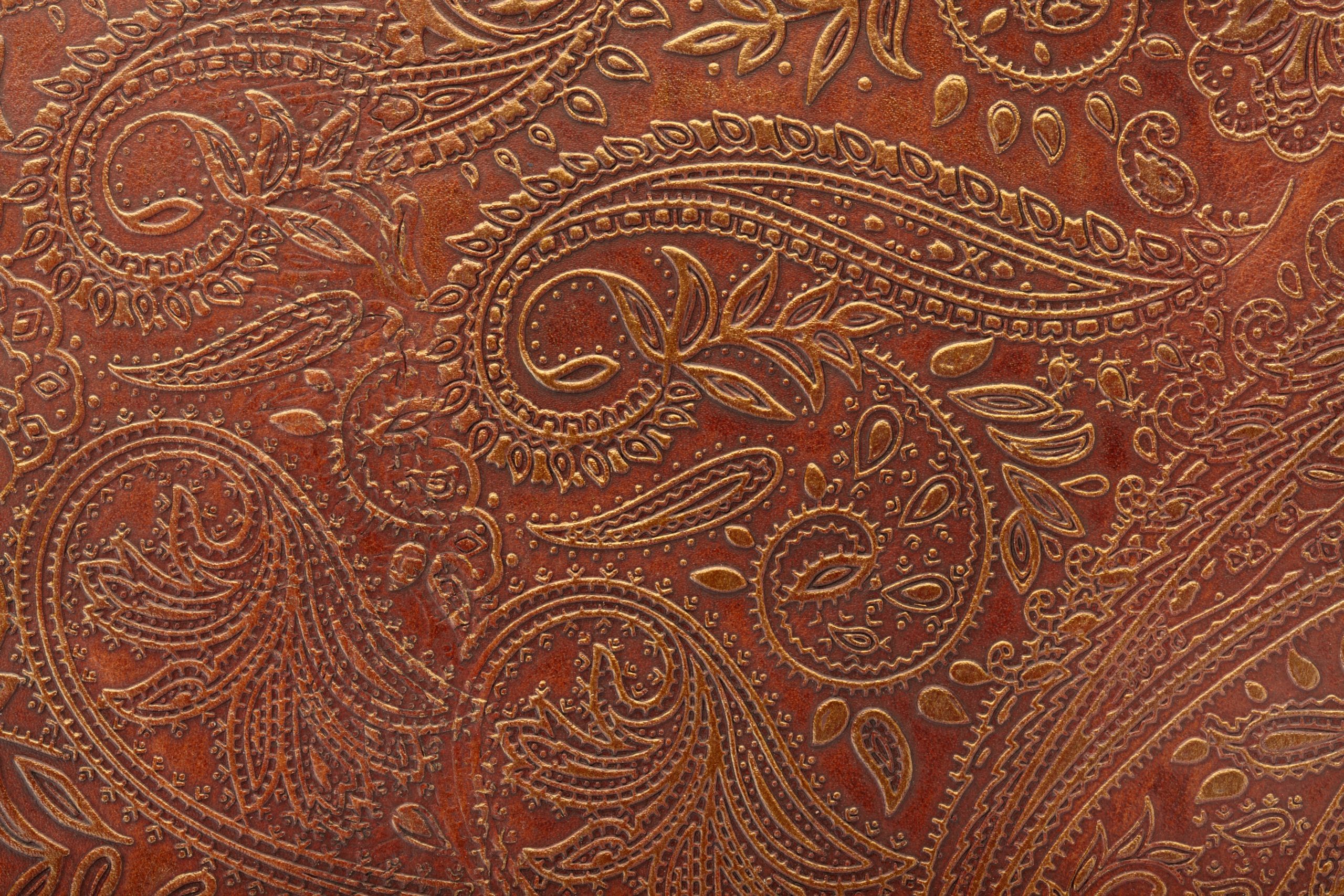 A brown tooled floral pattern